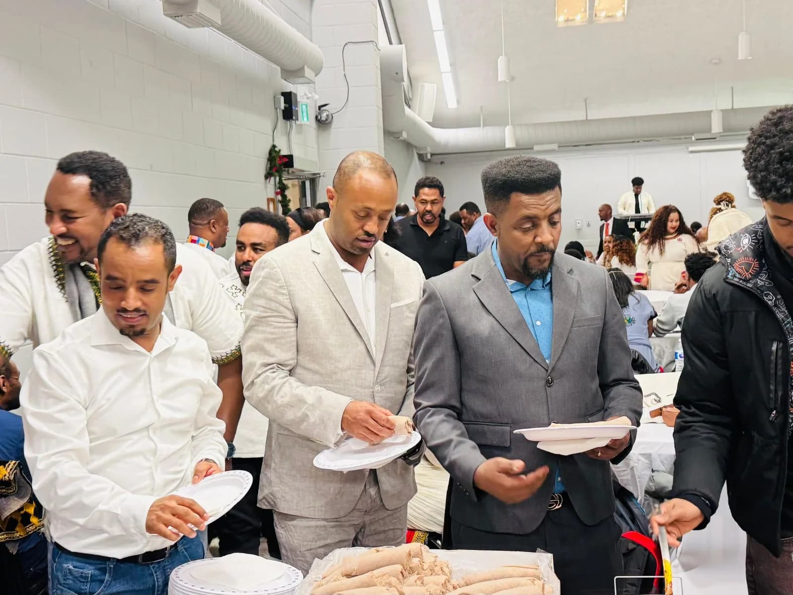 Volunteers sharing a meal together at an Ebenezer Relief Society event