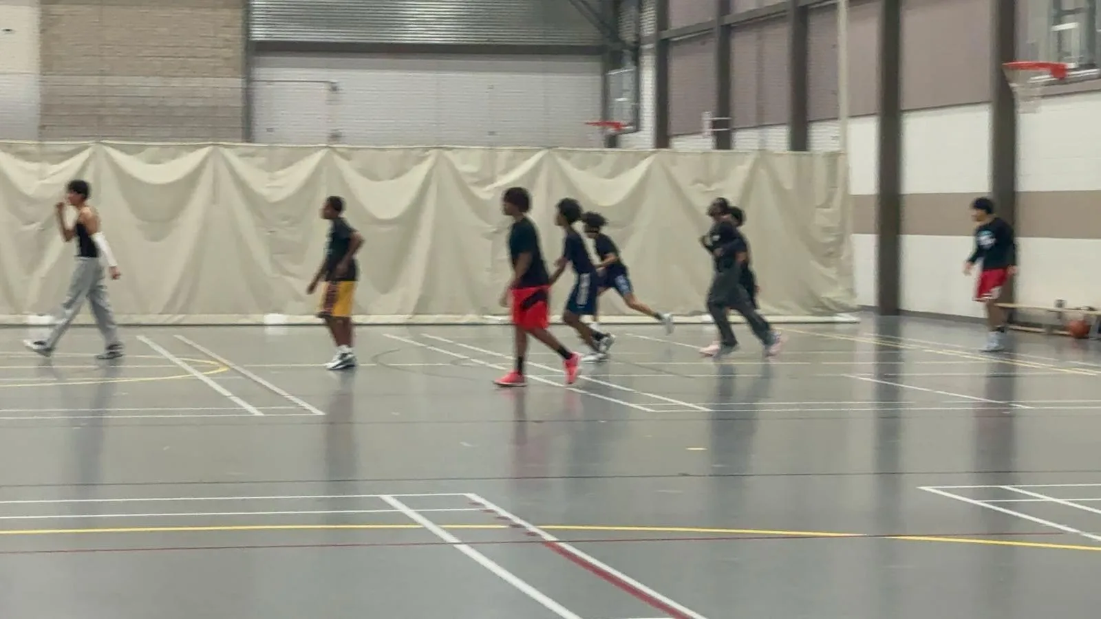 Youth playing basketball through the Ebenezer Relief Society sports program