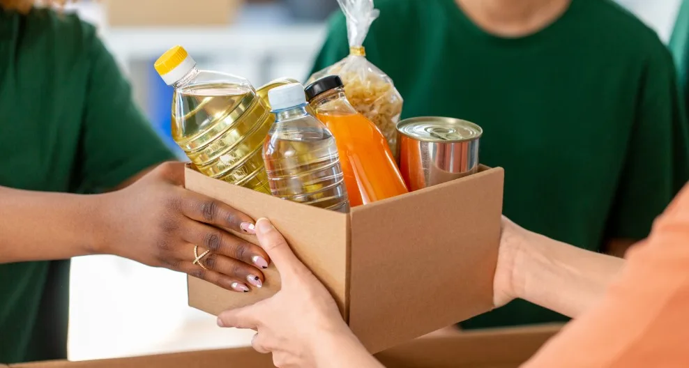 Volunteers distributing food and medical support to families in need